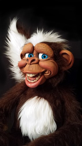 A hand-built ape ventriloquial figure turning its eyes and opening its mouth, created by figure maker Chance Wolf